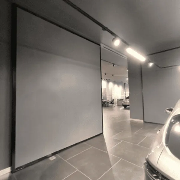 Installation porte de garage sectionnelle motorisée à Charleroi par AL Menuiserie